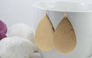 gold star dust teardrop earrings